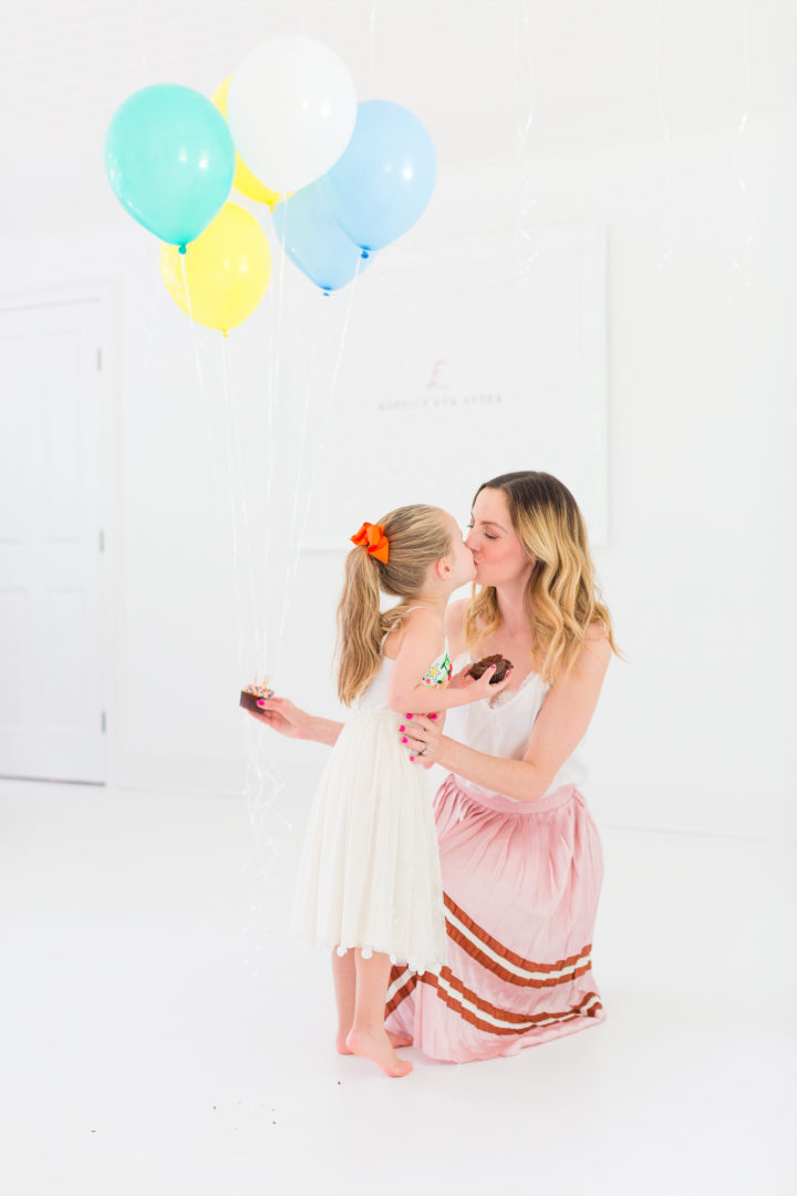 Eva Amurri Martino sweetly kisses her daughter Marlowe while they both enjoy cupcakes to celebrate the 3rd birthday of her blog Happily Eva After