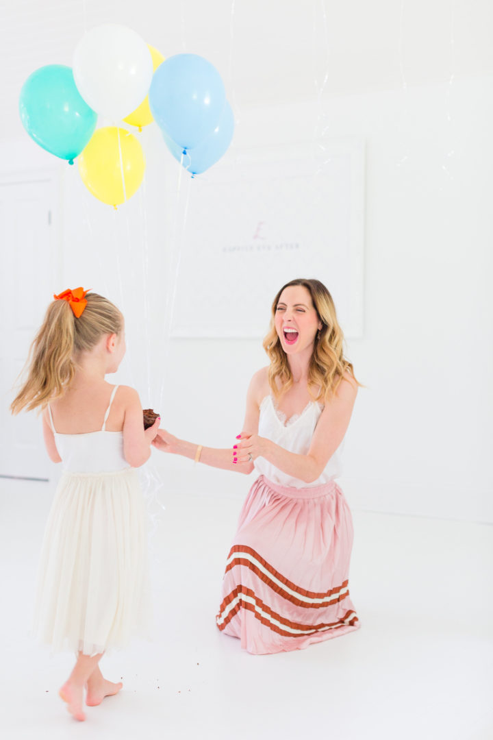 Eva Amurri Martino throws her hands in the air to celebrate the 3rd birthday of her blog Happily Eva After