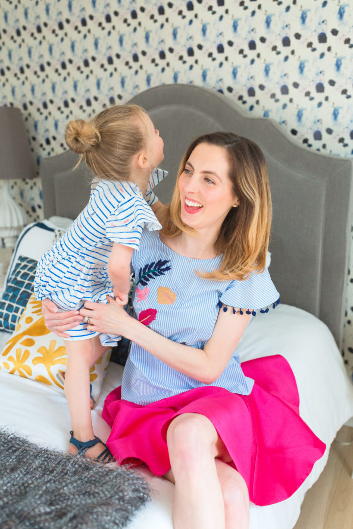 Eva Amurri Martino wears a bright pink skirt with her daughter Marlowe