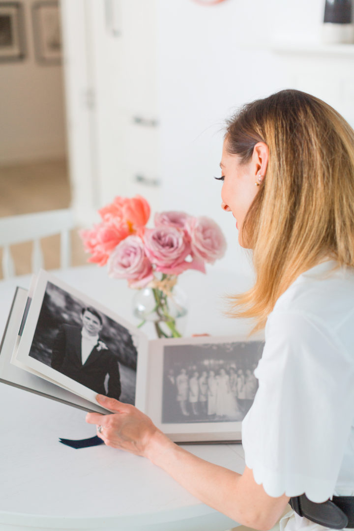 Eva Amurri Martino looks at a photo of her husband Kyle in their wedding album