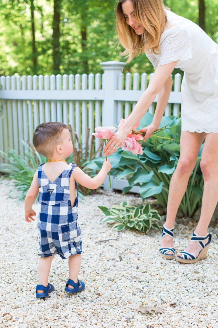 Eva Amurri Martino hands her son Major a flower from their garden in Connecticut.