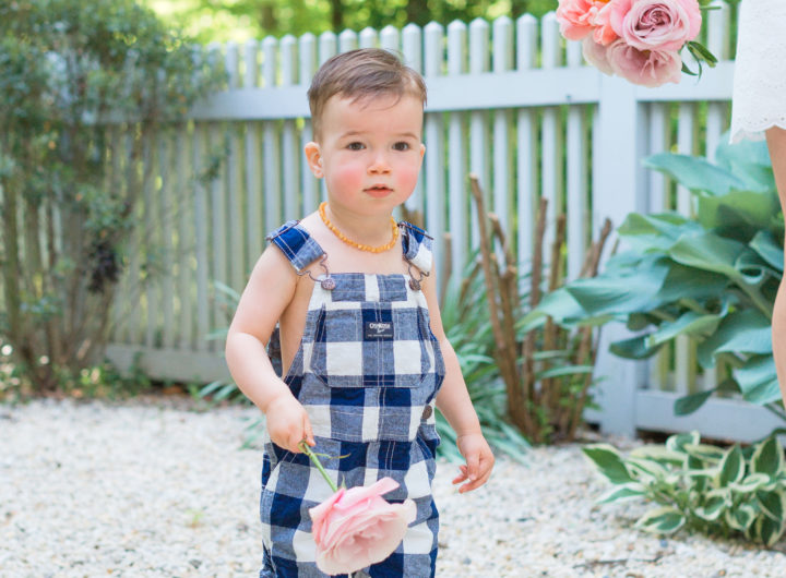 Eva Amurri Martino's son Major carries flowers from their garden in Connecticut.