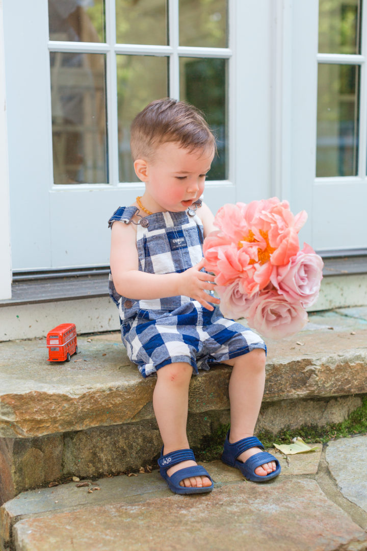 Eva Amurri Martino's son Major sit on a set with fresh cut flowers from their garden in Connecticut.