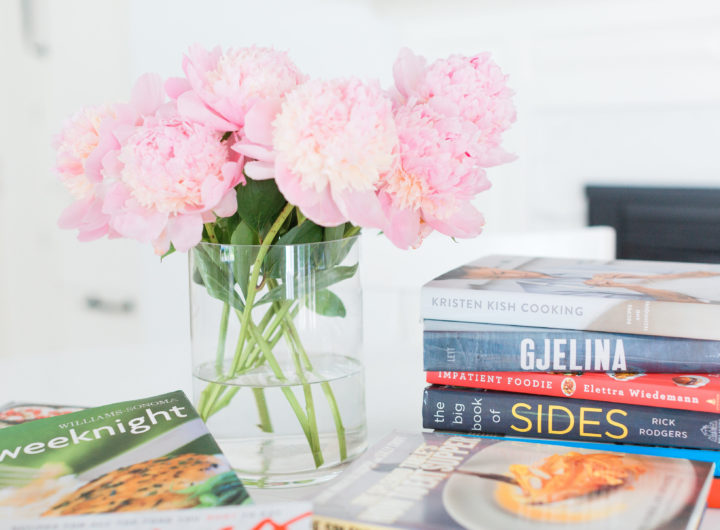 Eva Amurri Martino shares her favorite cookbooks next to a beautiful vase of peonies