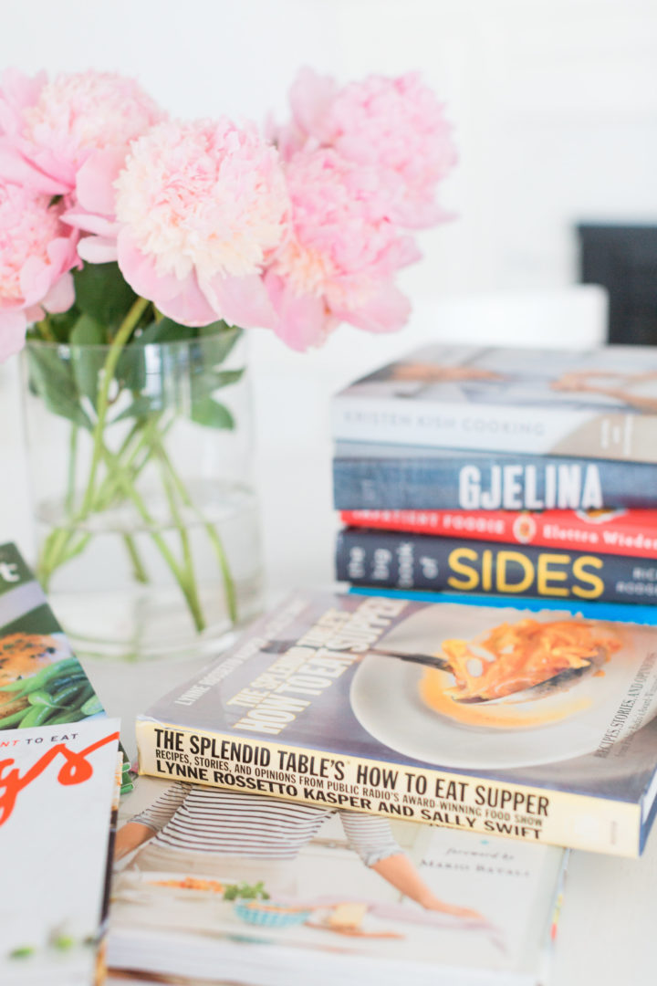 Eva Amurri Martino shares her favorite cookbooks next to a beautiful vase of peonies