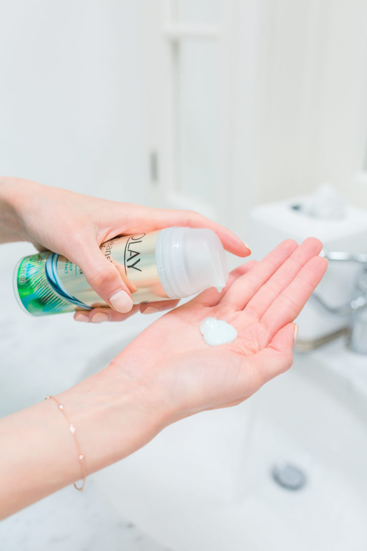 Eva Amurri Martino squeezes out some Olay into her hands before she cleanses her face.