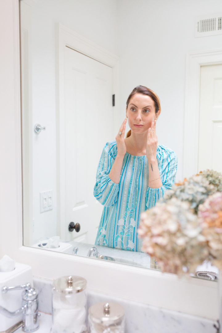 Eva Amurri Martino rubs Olay into her skin