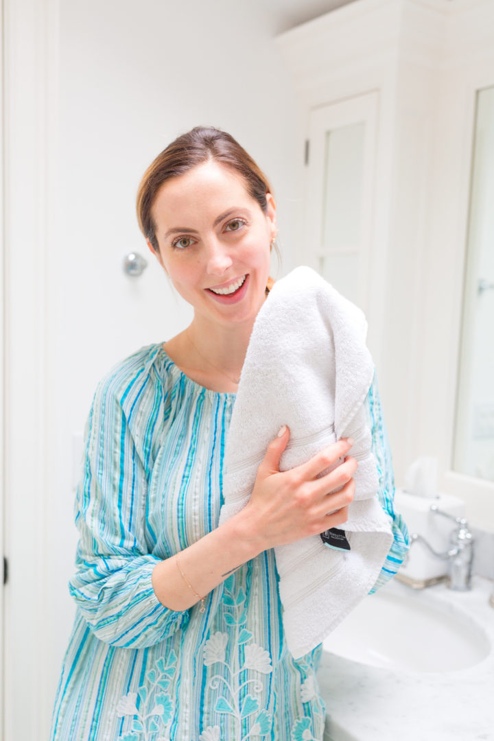 Eva Amurri Martino pats her face dry with a towel after completing her new summer cleansing routine