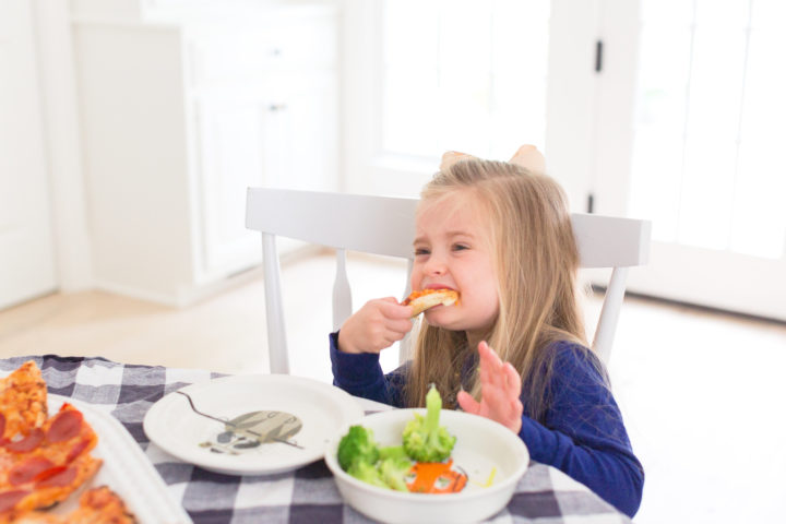 Eva Amurri Martino's daughter Marlowe enjoys a slice of Red Baron pizza for pizza night.