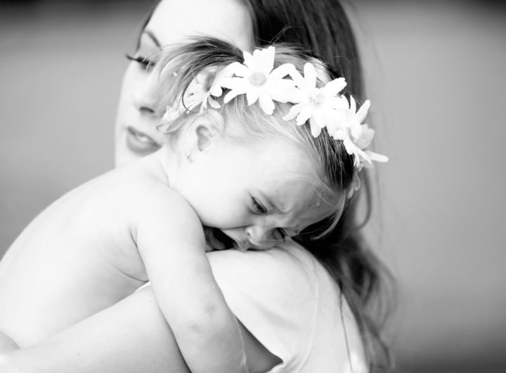 Eva Amurri Martino holds toddler daughter Marlowe in her arms in the yard of their sherman oaks home