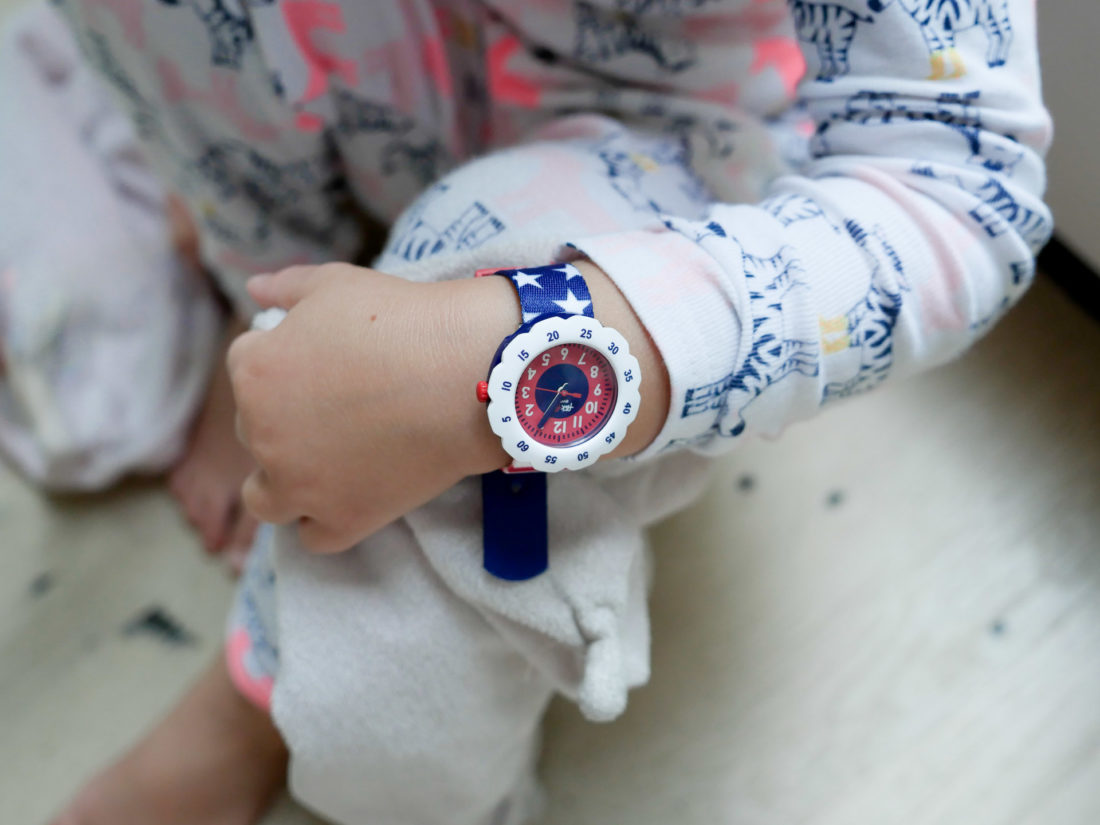 Marlowe Martino wears a fourth of july themed flik flak watch