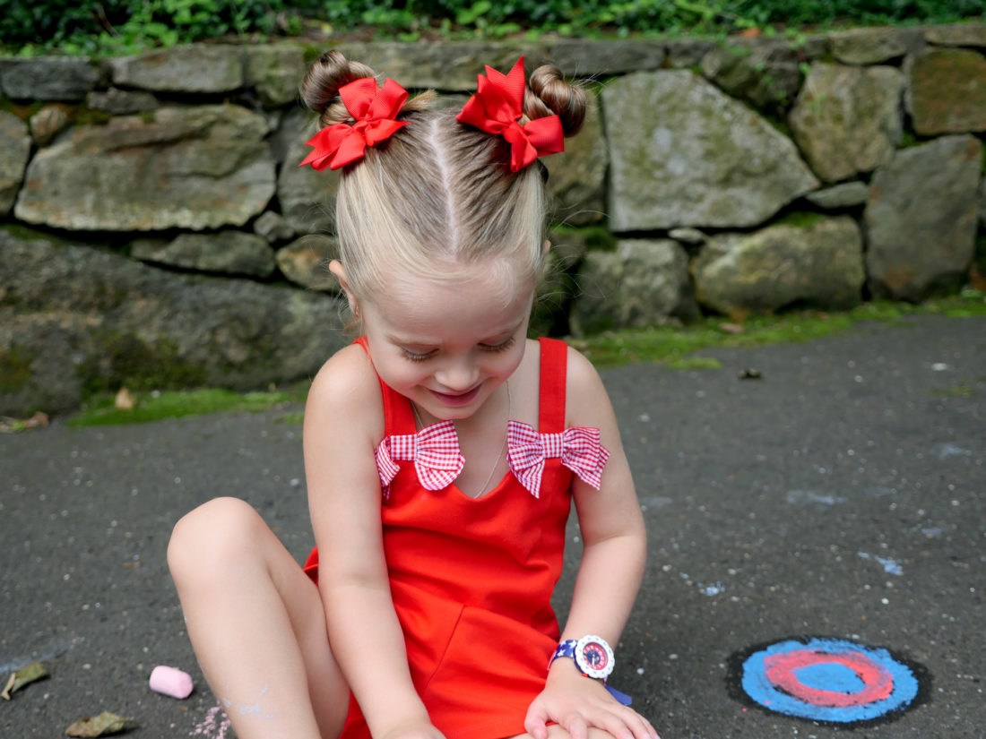 Marlowe Martino wears a red Janie and Jack romper for the fourth of july