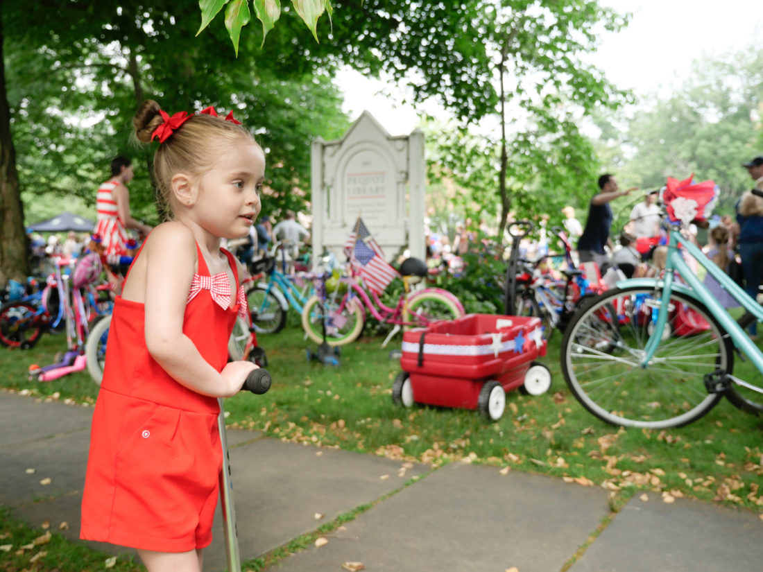 Marlowe Martino arrives at the kids' fourth of july bike parade in Southport, CT