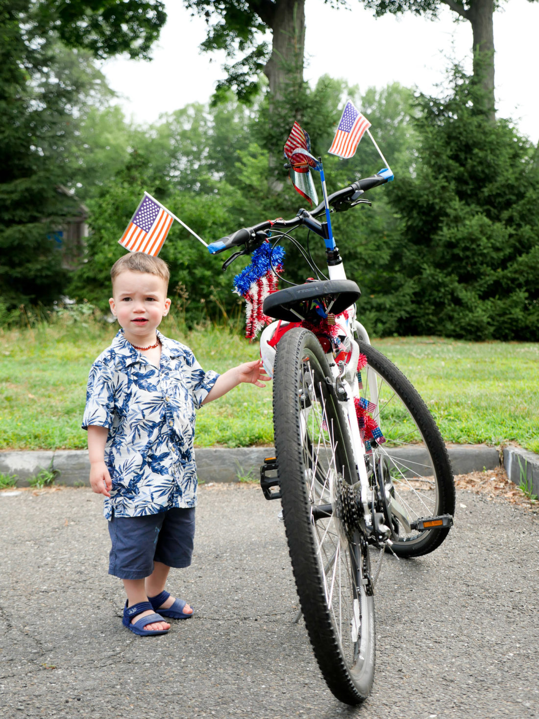 Major Martino admires a festively decorated fourth of july bike at a party in Connecticut