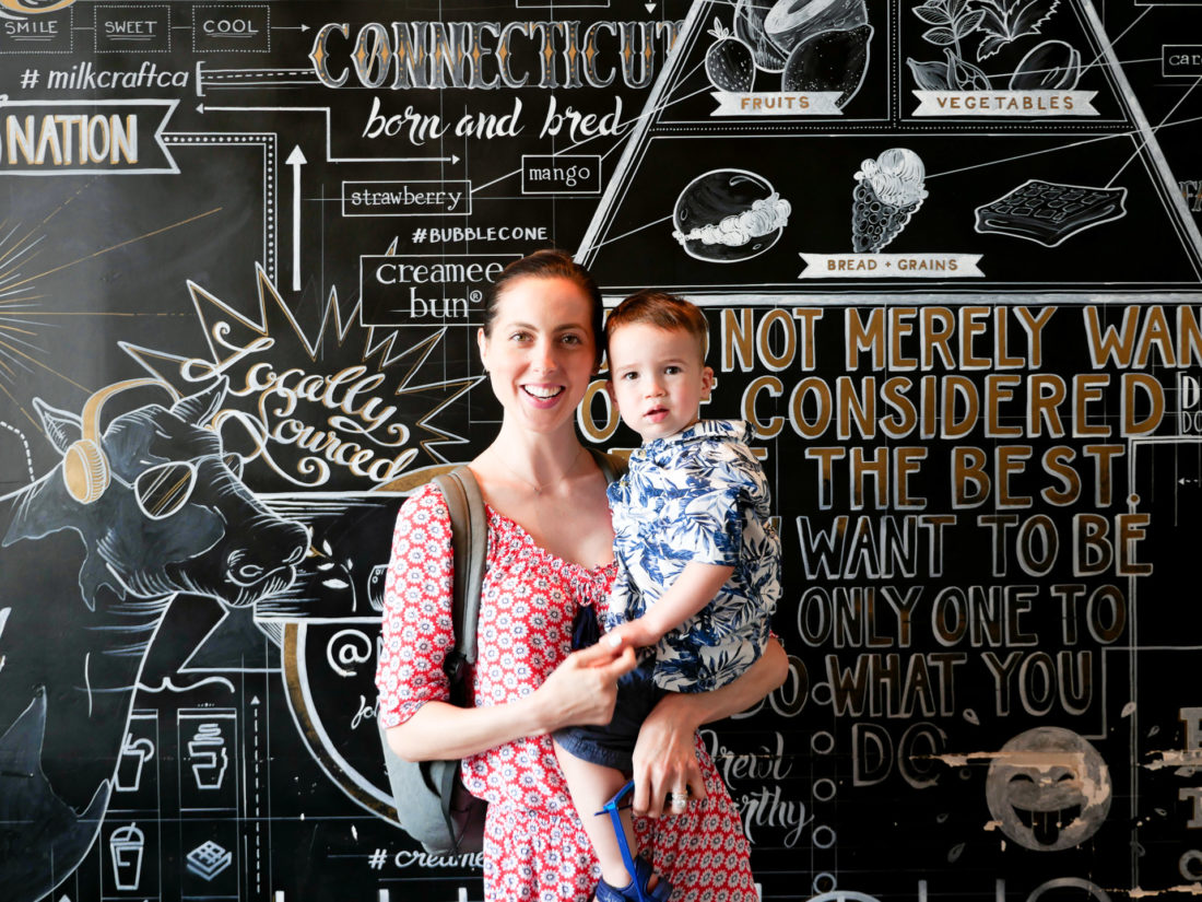 Eva Amurri Martino holds Major Martino, wearing red white and blue on the fourth of july in Connecticut