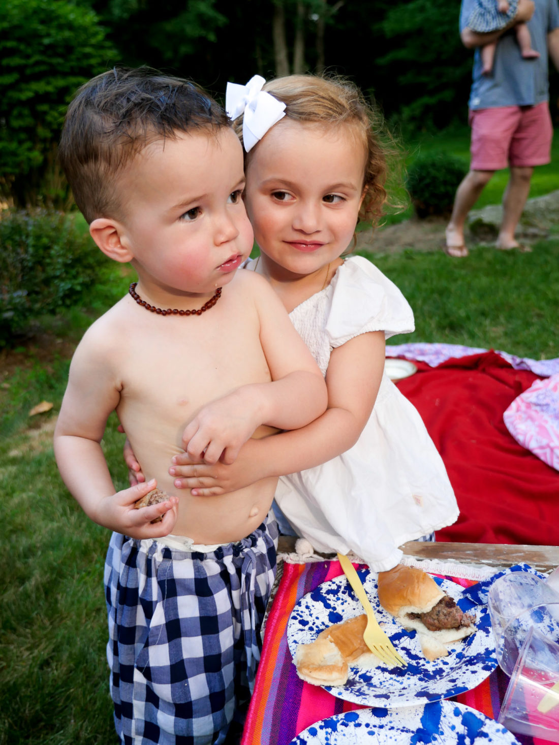 Major Martino gets a hug from a sweet little girl on the fourth of july in Connecticut