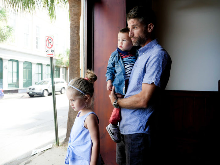 Eva Amurri Martino's husband Kyle looks out onto the Charleston street with their kids Marlowe and Major