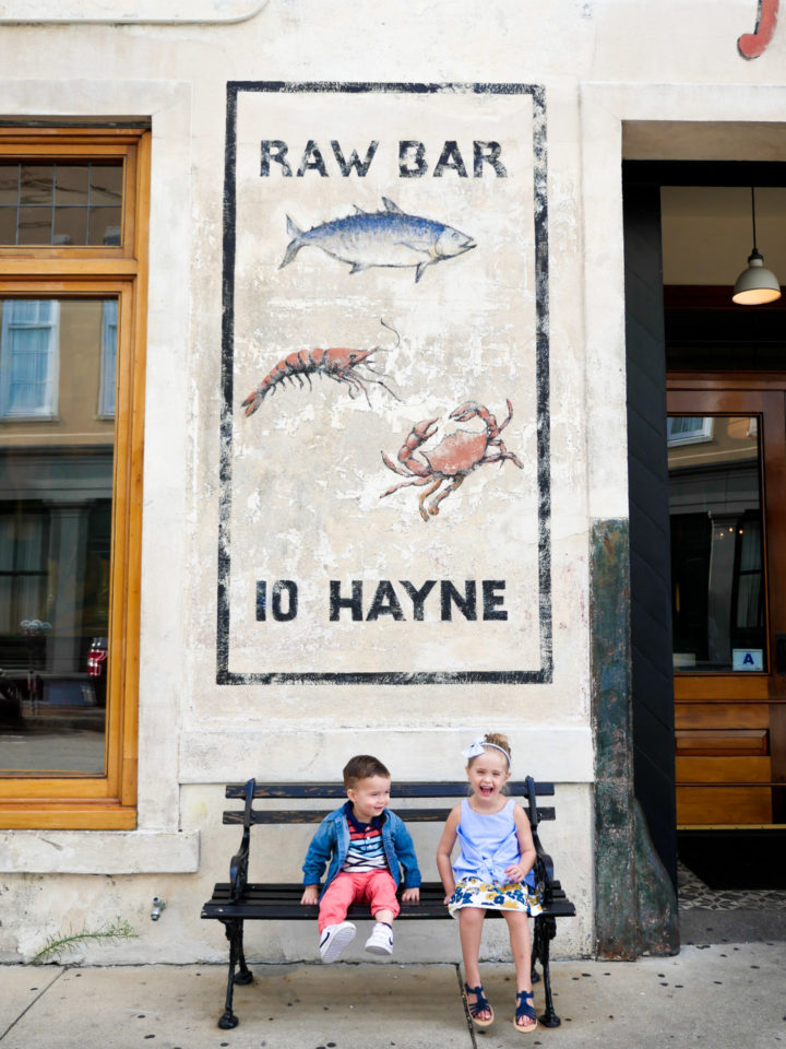 Eva Amurri Martino's kids Marlowe and Major sit outside of a raw bar in Charleston