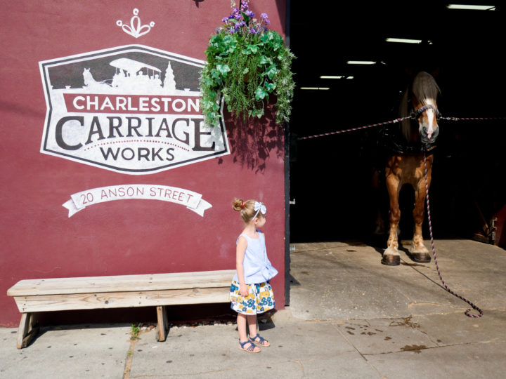 Eva Amurri Martino's daughter Marlowe stands in front of Charleston Carriage Works