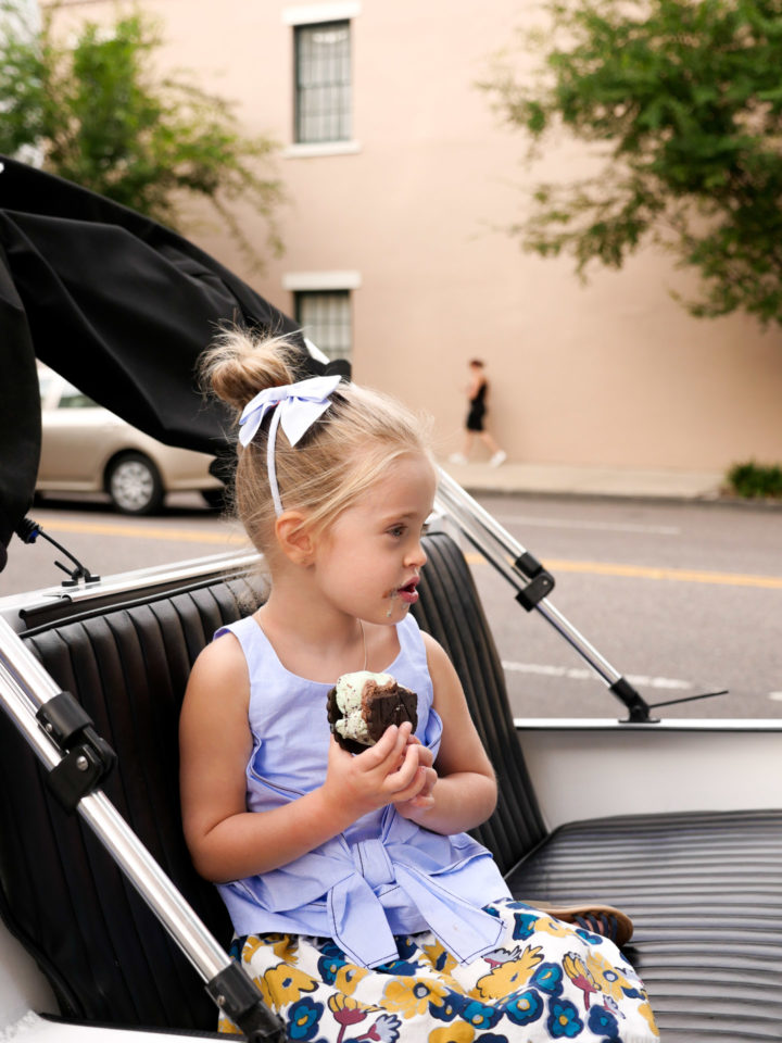 Eva Amurri Martino's daughter Marlowe covets her ice cream sandwich while sitting in the back of a peddy cab