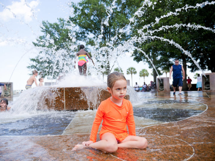 Eva Amurri Martino's daughter Marlowe sits in the sprinklers in Charleston