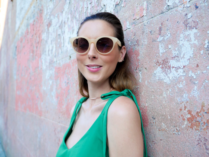 Eva Amurri Martino wears a pair of stylish nude sunglasses and a green sundress in Charleston