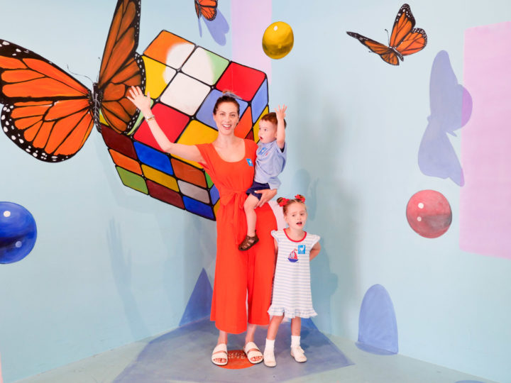 Eva Amurri Martino and her children Marlowe and Major pose in front of a colorful backdrop in Charleston