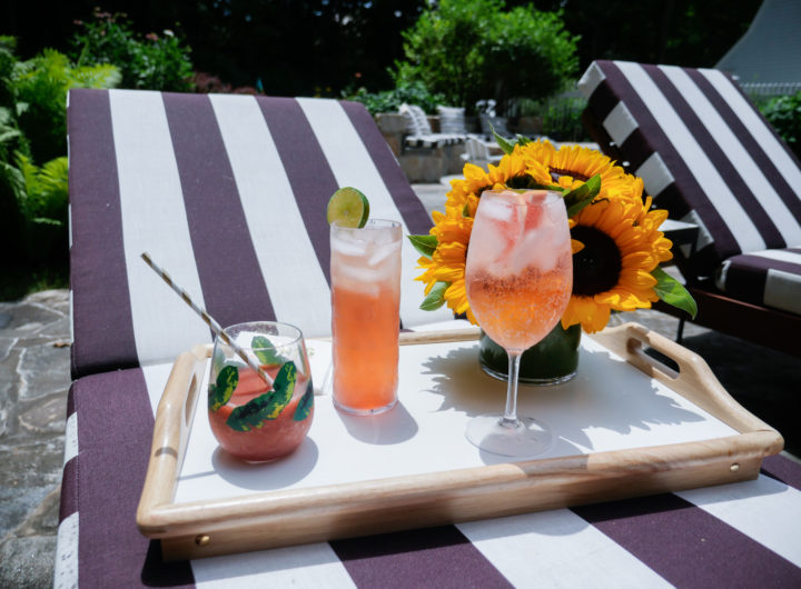 Eva Amurri Martino serves three different pink tinted cocktails to her guests poolside at her home in Connecticut