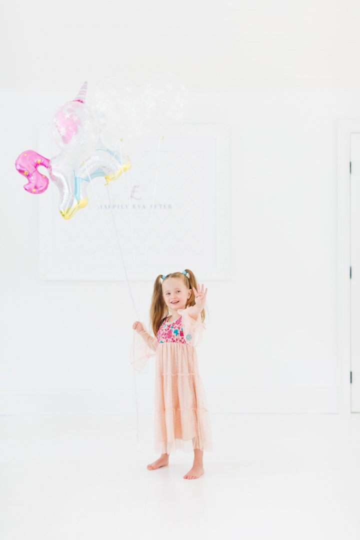 Eva Amurri Martino's daughter Marlowe holds a unicorn balloon for her 4th birthday