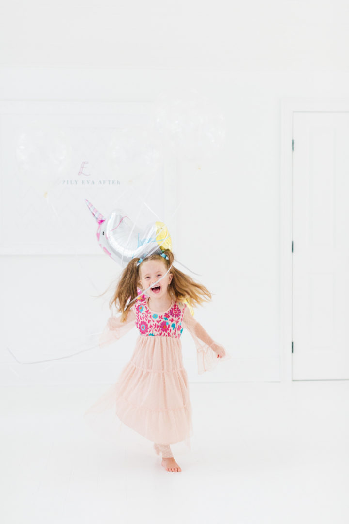 Eva Amurri Martino's daughter Marlowe holds a unicorn balloon for her 4th birthday