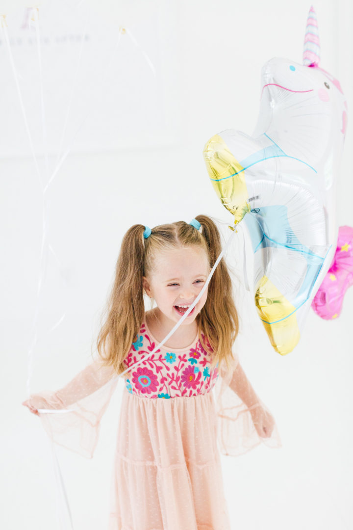 Eva Amurri Martino's daughter Marlowe holds a unicorn balloon for her 4th birthday