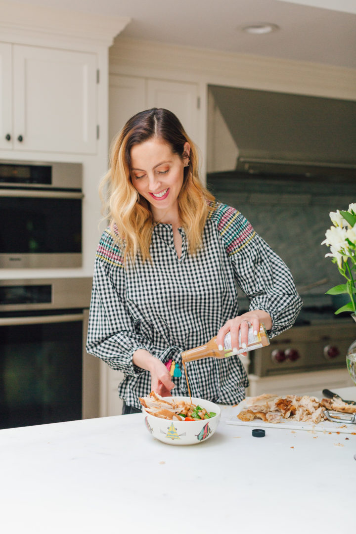 Eva Amurri Martino drizzles Annie Chun's Peanut Sauce onto a protein bowl