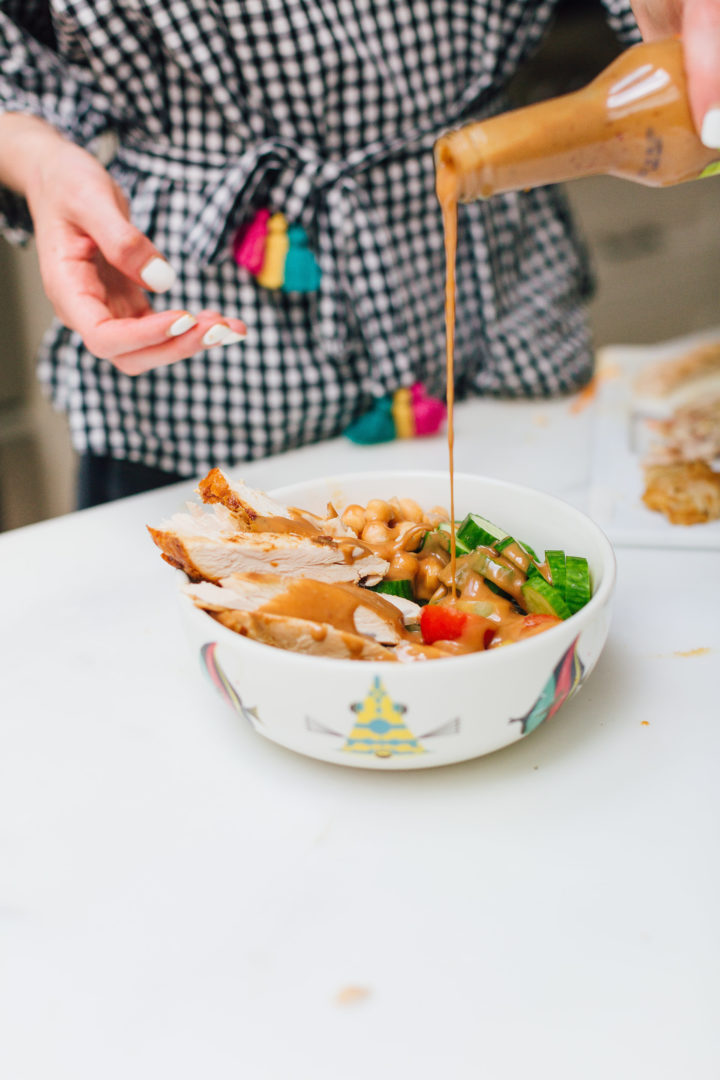 Eva Amurri Martino drizzles Annie Chun's Peanut Sauce onto a protein bowl