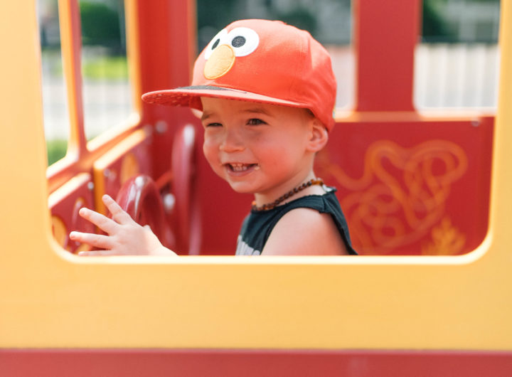 Major Martino drives in a pretend fire truck at the playground in Connecticut