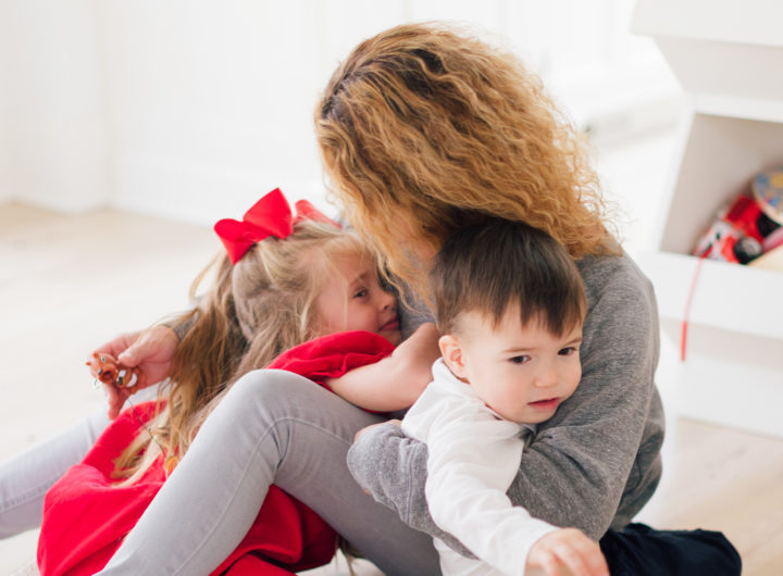 Marlowe and Major Martino snuggle their nanny in the family room of their connecticut home