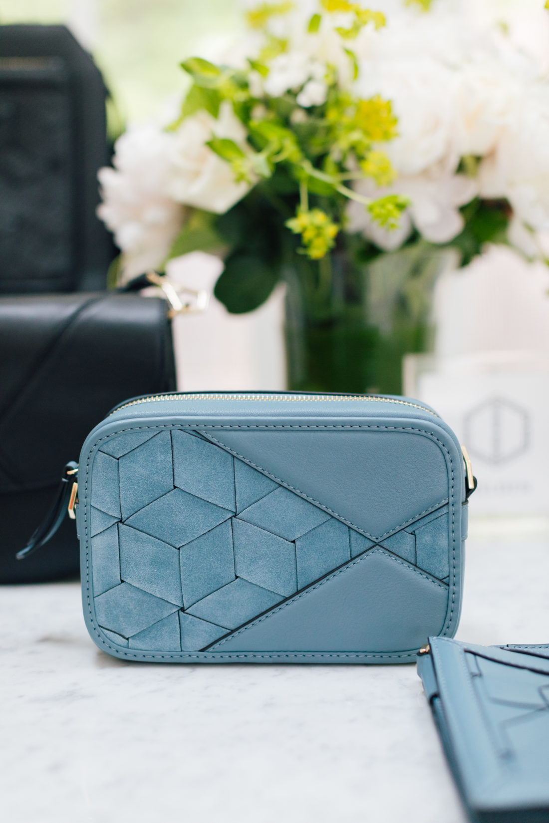 A selection of Welden bags sits atop a table in the Happily Eva After studio