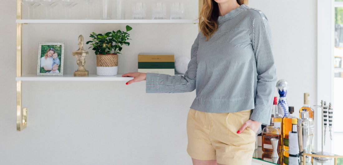 Eva Amurri Martino stands next to shelving in her dining room