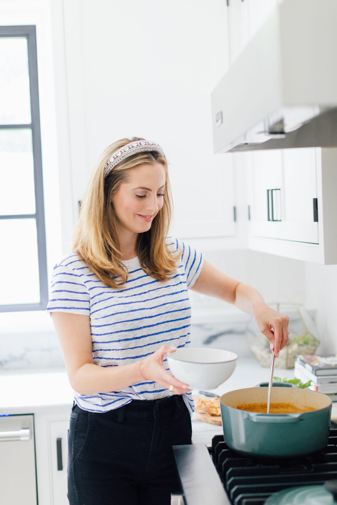 Eva Amurri Martino ladles her Heirloom Tomato Soup into a bowl