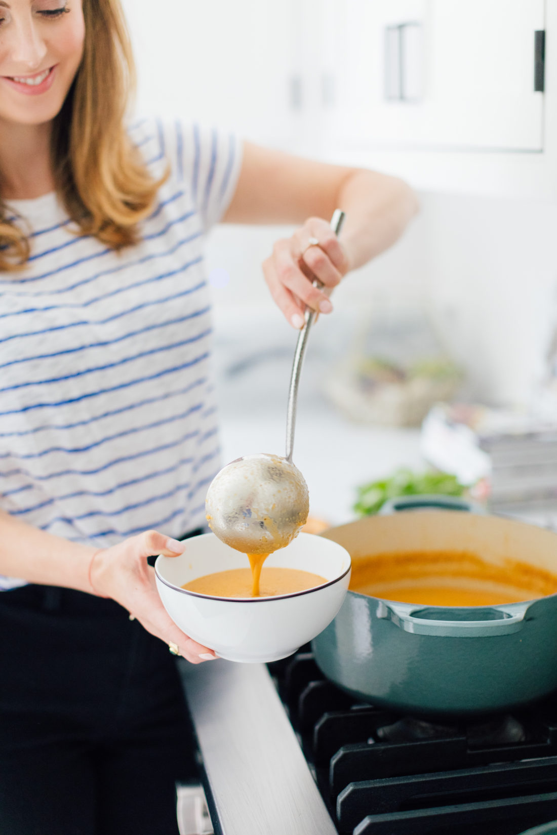 Eva Amurri Martino ladles her Heirloom Tomato Soup into a bowl