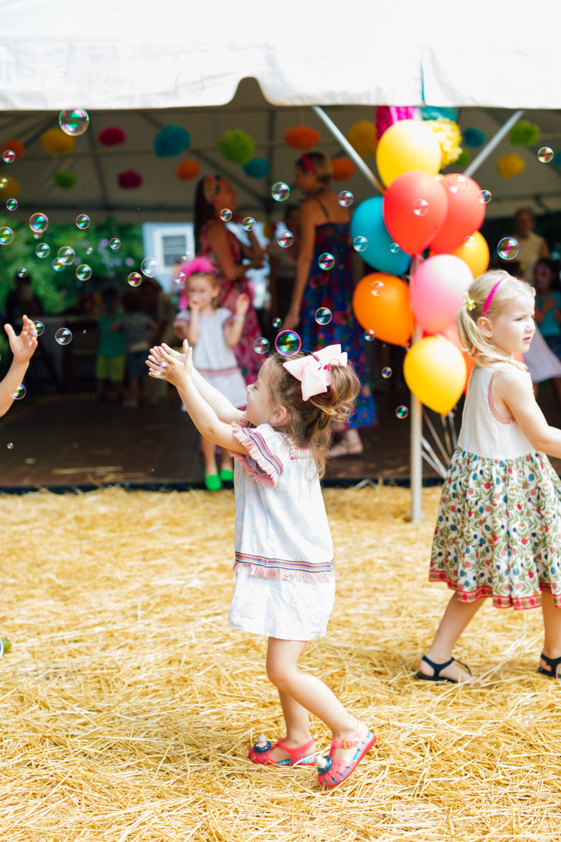 Children play with bubbles at Marlowe Martino's El Cinco de Marlowe themed 5th birthday fiesta