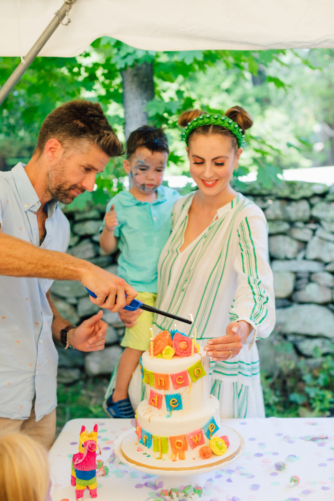 Kyle Martino lights daughter Marlowe's birthday cake at her Cinco de Marlowe themed 5th birthday fiesta