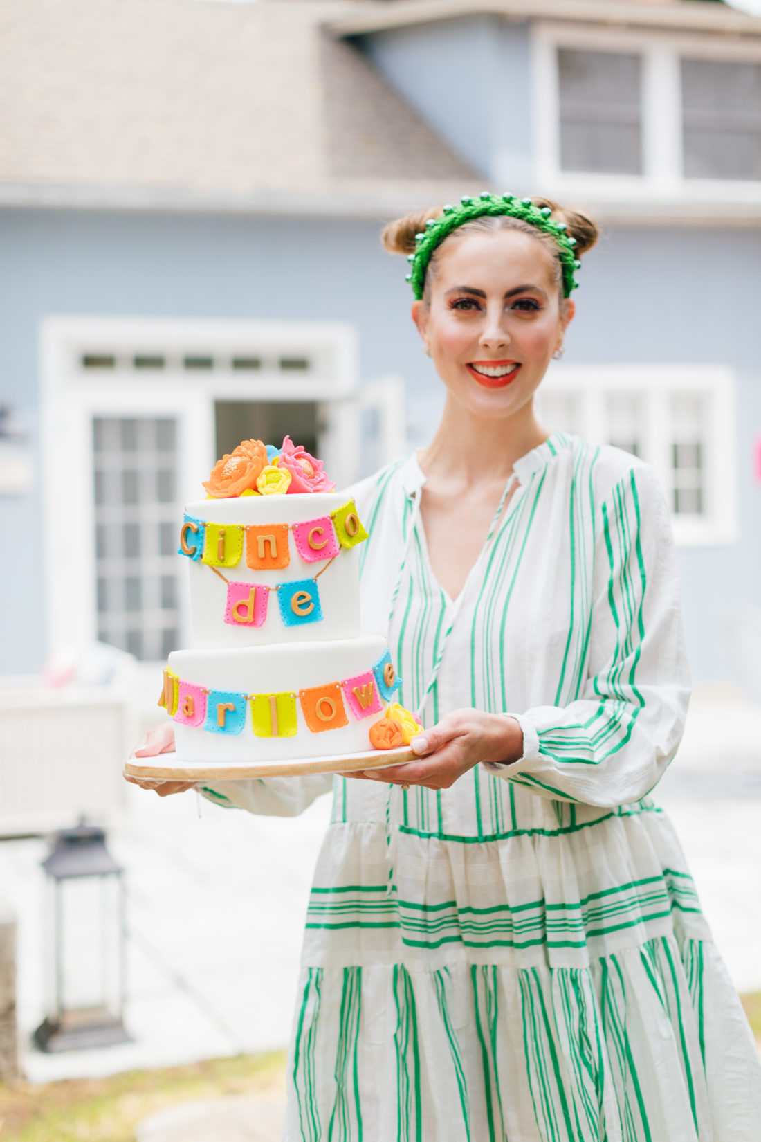 Eva Amurri Martino holds daughter Marlowe's birthday cake at her Cinco de Marlowe themed 5th birthday party