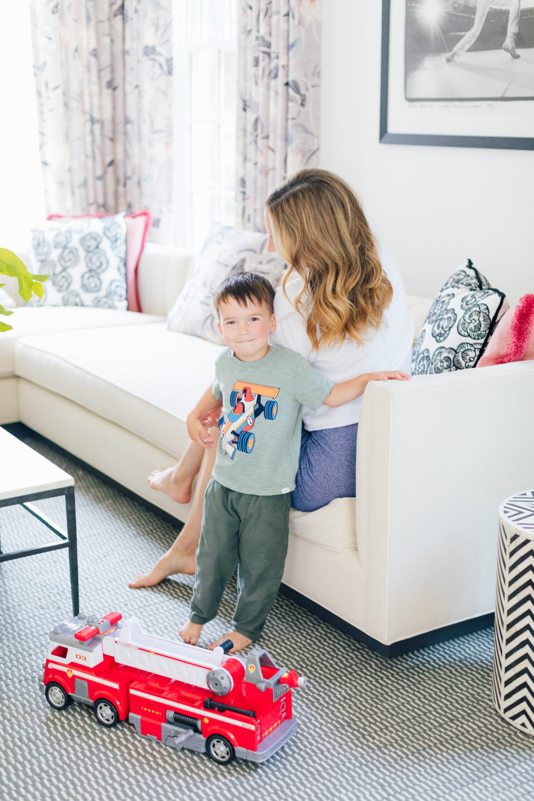 Eva Amurri Martino plays with son Major in a rainbow sweatshirt showing off her easy pretty curls