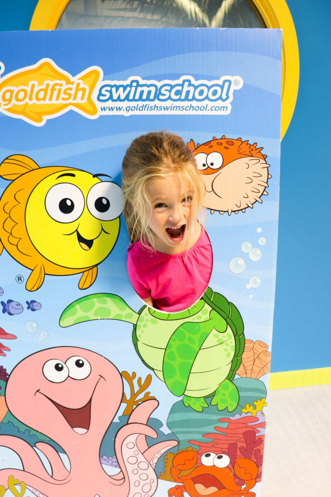 Marlowe Martino posing at her local swim school Goldfish Swim School