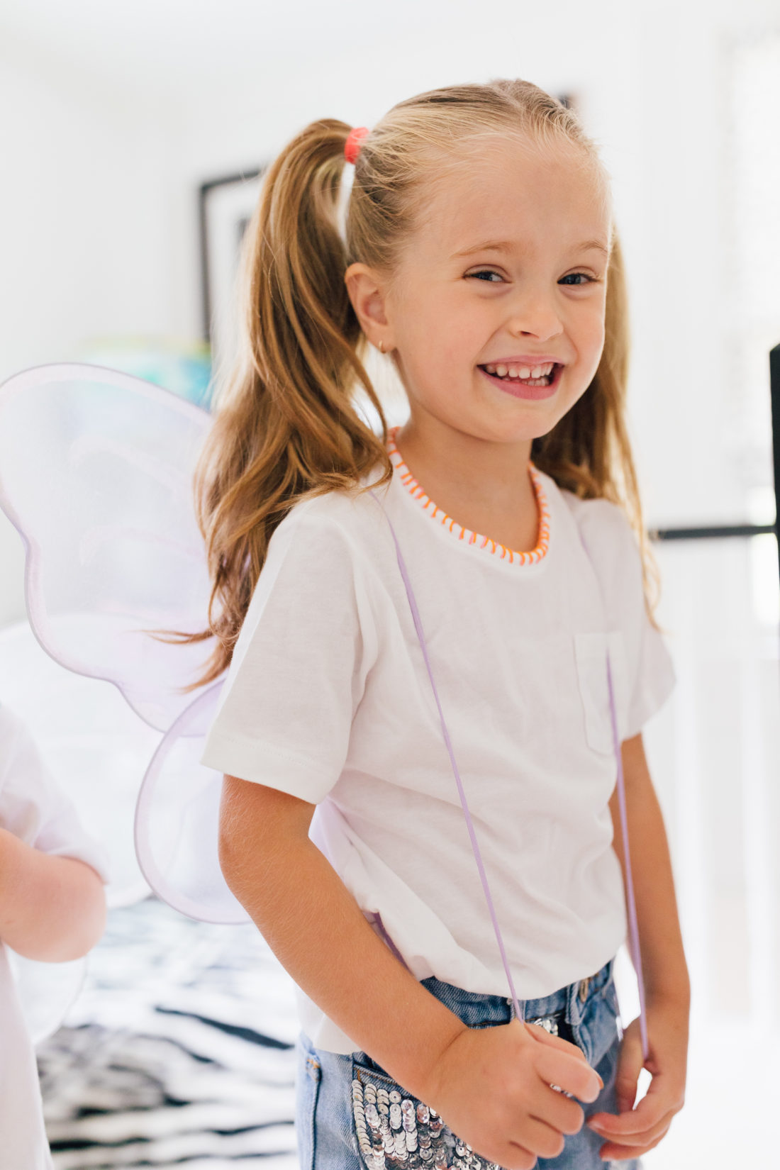 Marlowe Martino wearing a DIY embroidered shirt made by her mother Eva Amurri Martino