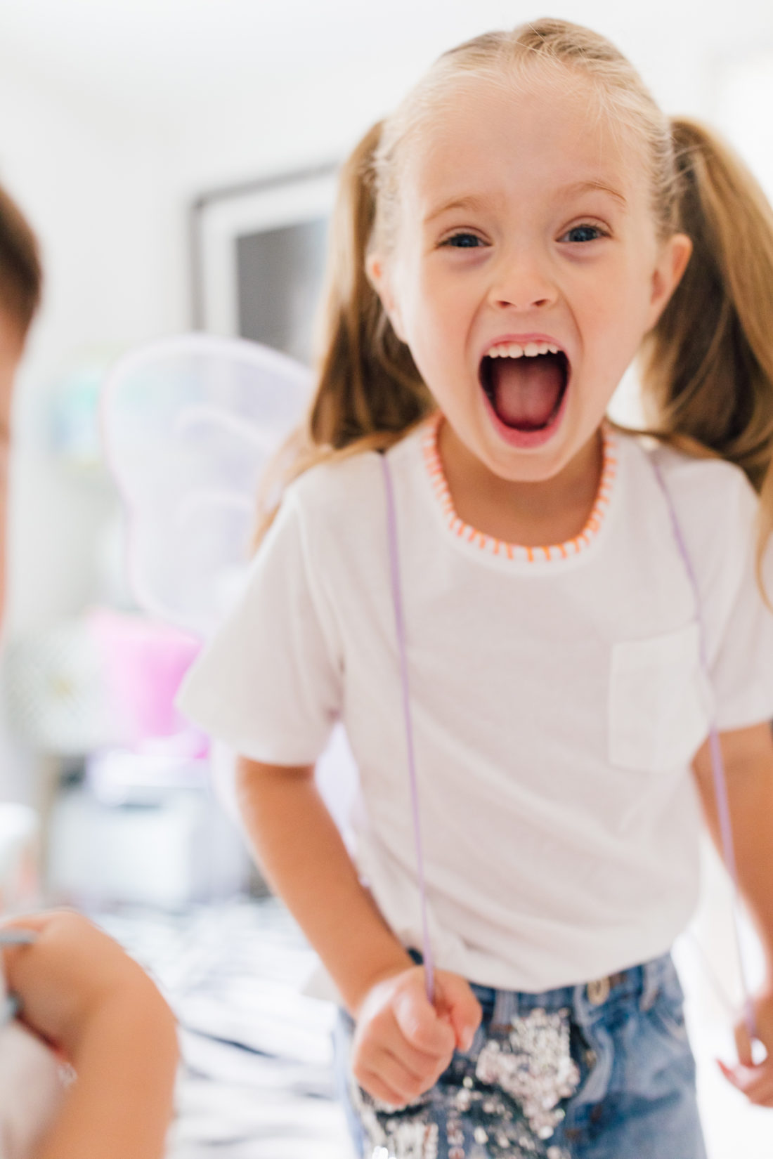 Marlowe Martino wearing a DIY embroidered shirt made by her mother Eva Amurri Martino