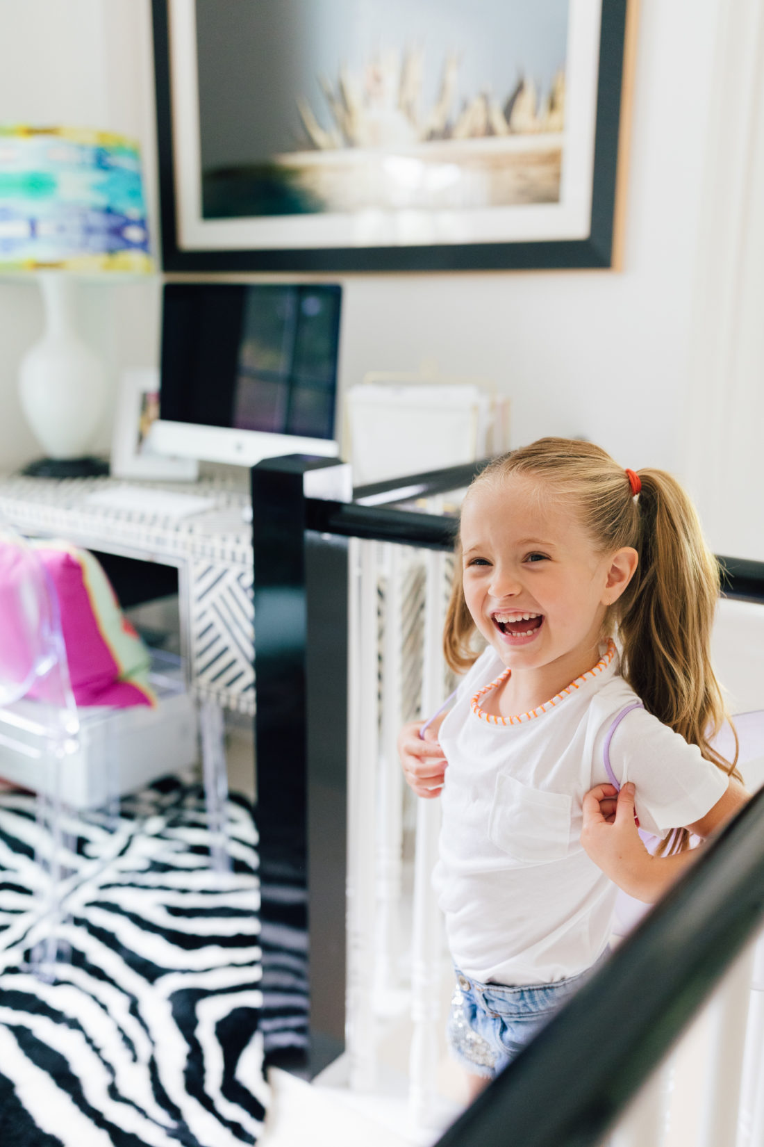 Marlowe Martino wearing a DIY embroidered shirt made by her mother Eva Amurri Martino