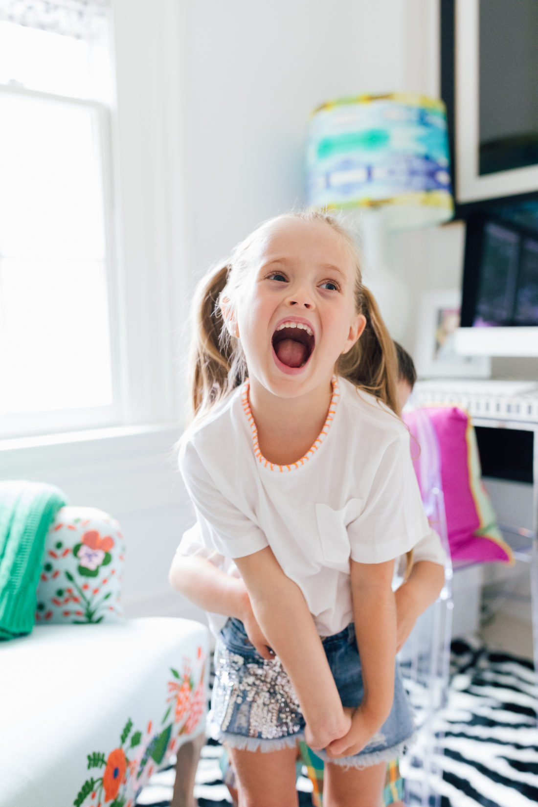 Marlowe Martino wearing a DIY embroidered shirt made by her mother Eva Amurri Martino