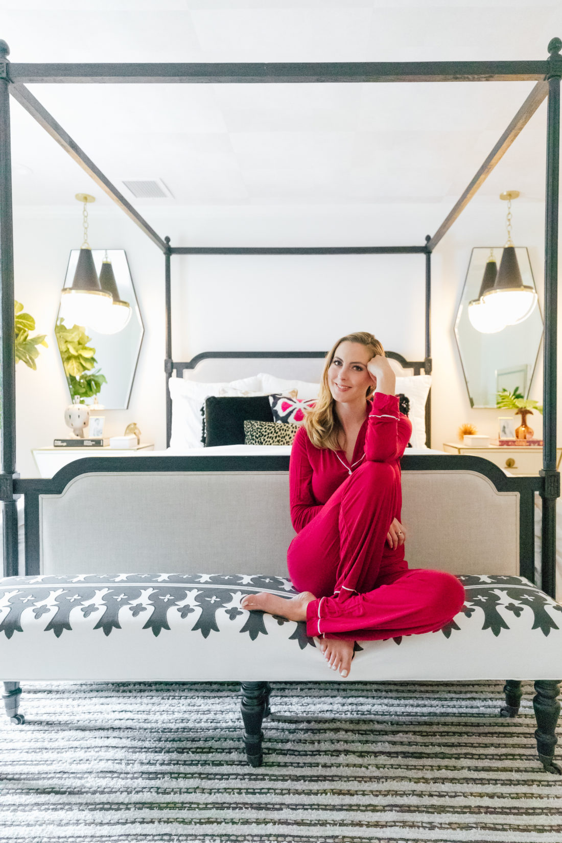 Eva Amurri Martino wears red pajamas while sitting inside her new master bedroom