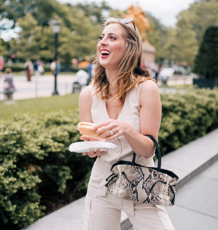 Eva Amurri martino eats a hot dog on the streets of NYC